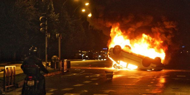 Image of a burning car during the 2005 riots