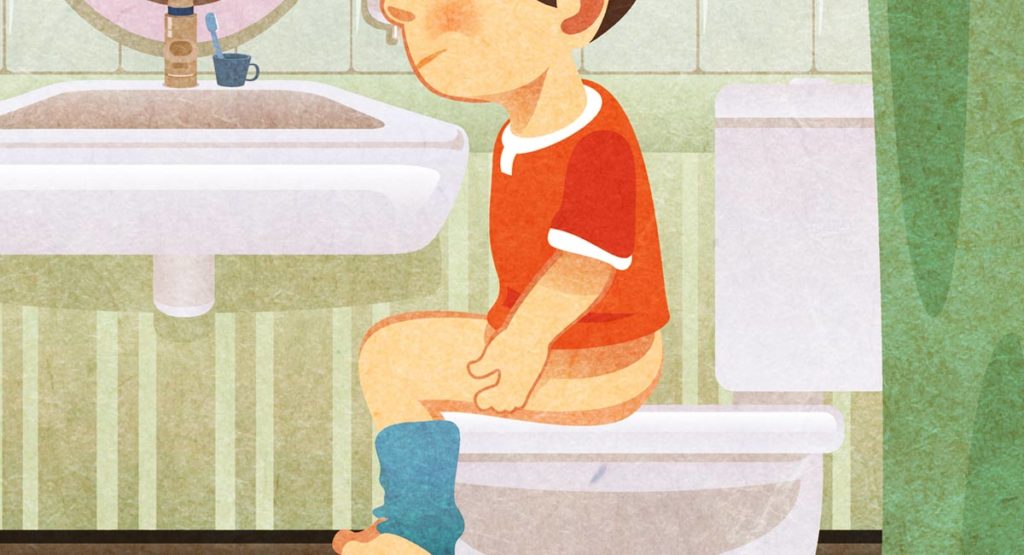 Image of little boy learning to use the toilet